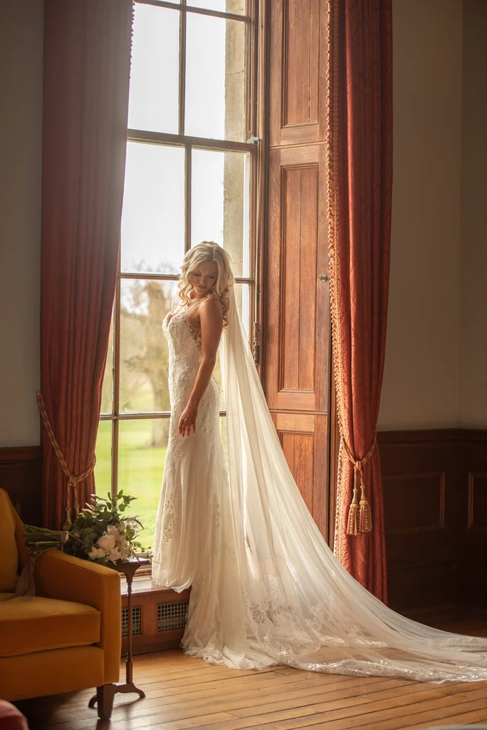 Bride adjusting her earring before the ceremony
