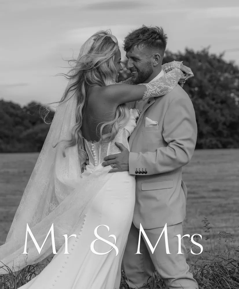 Black and white album cover: the couple embracing in a field above the words Mr & Mrs